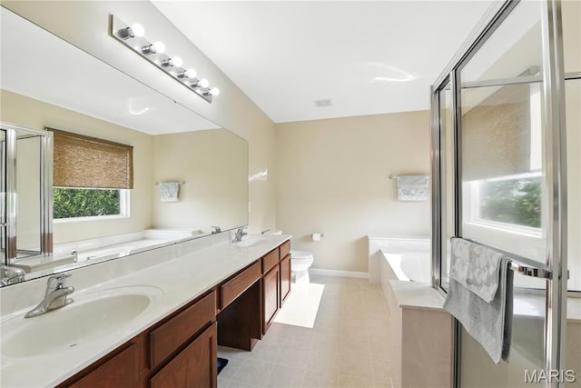 457 Spring Trce, Ofallon, MO 63368 - full bathroom featuring a garden tub, double vanity, and a stall shower
