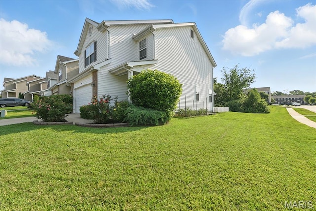 457 Spring Trce, Ofallon, MO 63368 - view of property exterior featuring an attached garage and a yard