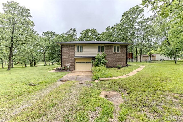20193 SW Oakwood Dr, Lebanon, MO 65536 - view of front of property with driveway, a garage, a front yard, and brick siding