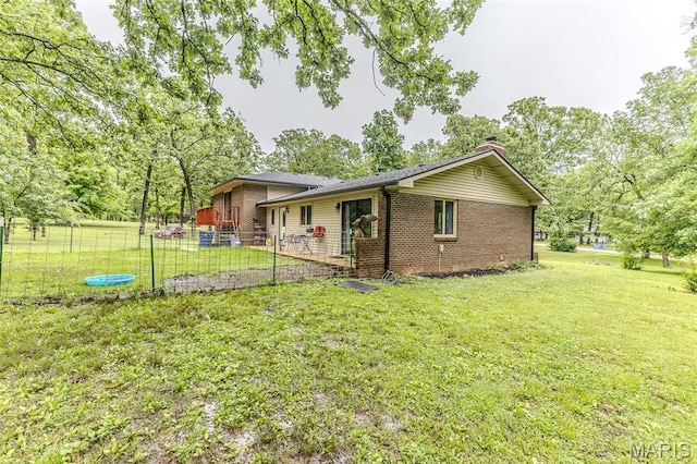 20193 SW Oakwood Dr, Lebanon, MO 65536 - view of side of property with brick siding and a chimney
