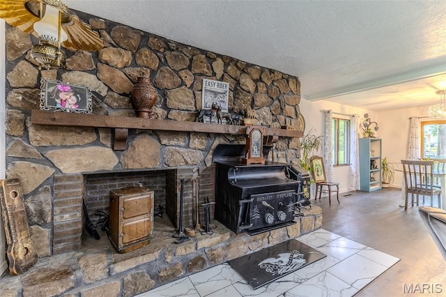 20193 SW Oakwood Dr, Lebanon, MO 65536 - living area featuring a textured ceiling, baseboards, a wood stove, and a chandelier