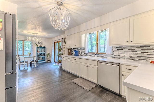 20193 SW Oakwood Dr, Lebanon, MO 65536 - kitchen with dishwasher, a chandelier, high end fridge, a sink, and tasteful backsplash
