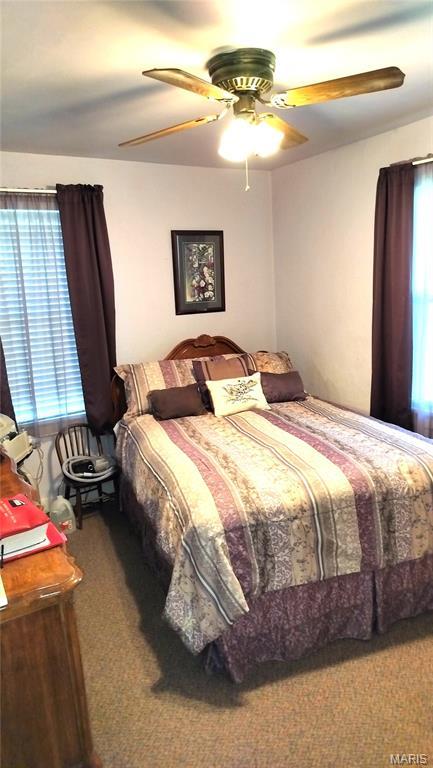 1500 Perryville Rd, Cape Girardeau, MO 63701 - carpeted bedroom featuring a ceiling fan