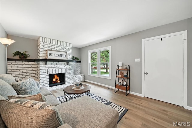 208 Mill Run Ln, Saint Peters, MO 63376 - living area with wood finished floors and a fireplace