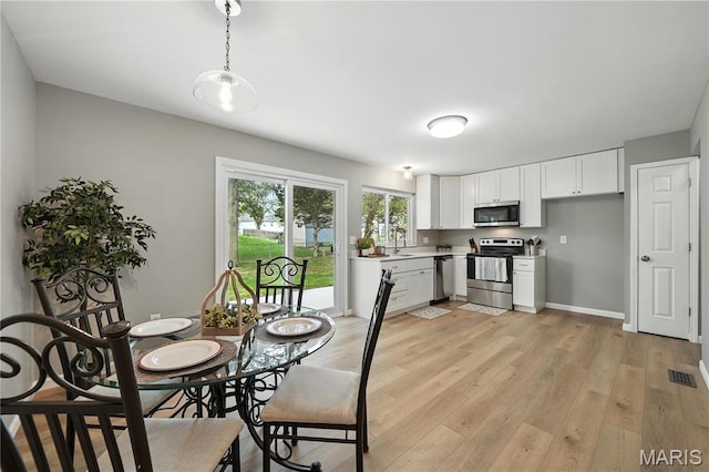 208 Mill Run Ln, Saint Peters, MO 63376 - dining space with light wood-style flooring and baseboards