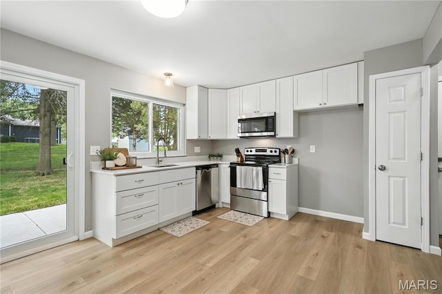208 Mill Run Ln, Saint Peters, MO 63376 - kitchen with appliances with stainless steel finishes, healthy amount of natural light, and white cabinetry