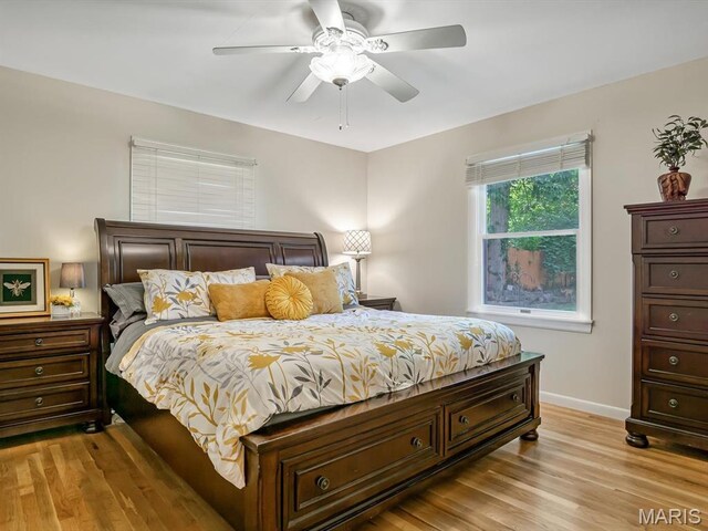 201 Banner St, Edwardsville, IL 62025 - bedroom featuring light wood finished floors, baseboards, and a ceiling fan