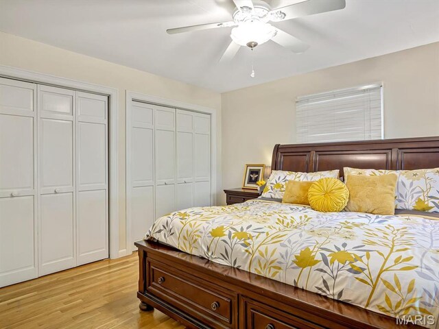 201 Banner St, Edwardsville, IL 62025 - bedroom featuring two closets, light wood-type flooring, and ceiling fan