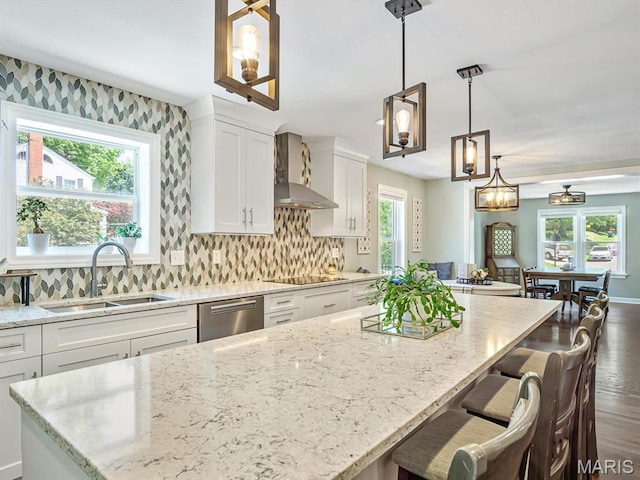 201 Banner St, Edwardsville, IL 62025 - kitchen with wall chimney range hood, dishwasher, a sink, white cabinets, and light stone counters