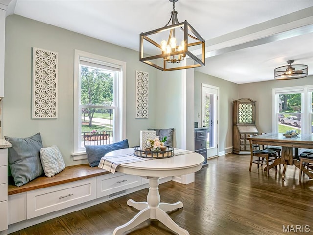 201 Banner St, Edwardsville, IL 62025 - dining area with plenty of natural light, a chandelier, dark wood finished floors, and a ceiling fan