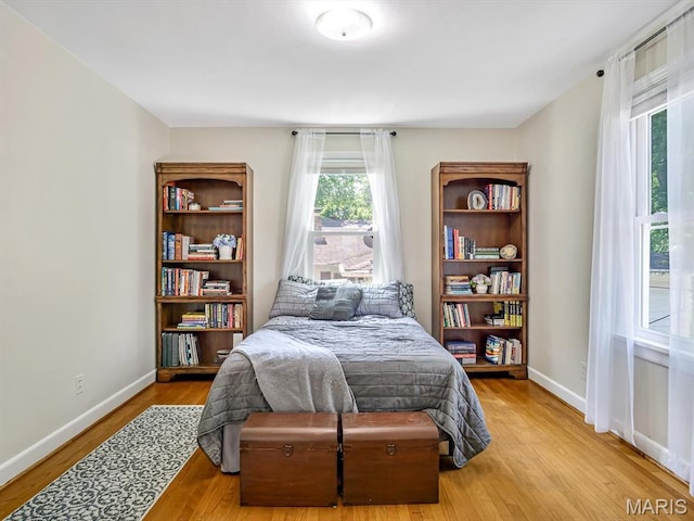 201 Banner St, Edwardsville, IL 62025 - bedroom featuring multiple windows, wood finished floors, and baseboards