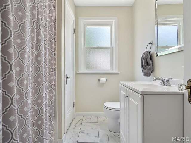 201 Banner St, Edwardsville, IL 62025 - full bath with vanity, marble finish flooring, toilet, and baseboards