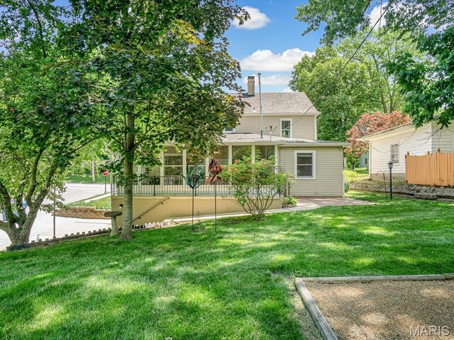 201 Banner St, Edwardsville, IL 62025 - back of house with a patio area and a chimney