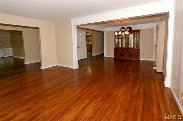 12713 Partridge Run Dr, Florissant, MO 63033 - unfurnished living room featuring a chandelier, wood finished floors, and baseboards