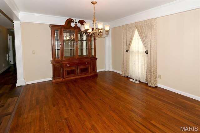12713 Partridge Run Dr, Florissant, MO 63033 - unfurnished dining area featuring a chandelier, wood finished floors, ornamental molding, and baseboards