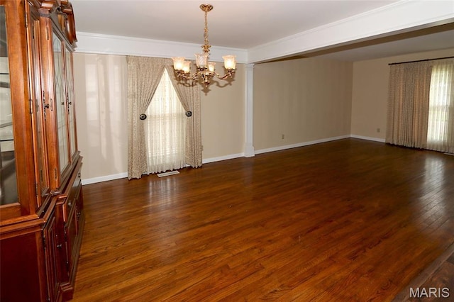 12713 Partridge Run Dr, Florissant, MO 63033 - spare room featuring a chandelier, dark wood-style floors, baseboards, and ornamental molding