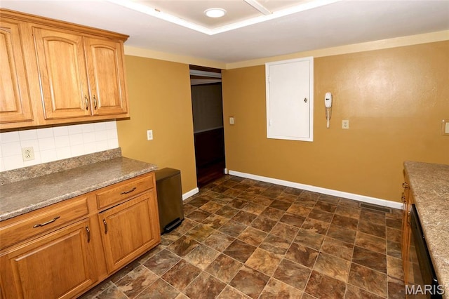 12713 Partridge Run Dr, Florissant, MO 63033 - kitchen with baseboards, decorative backsplash, stone finish floors, and brown cabinetry
