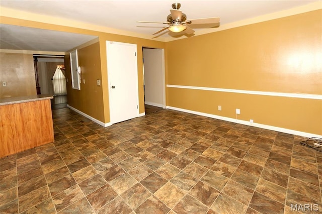 12713 Partridge Run Dr, Florissant, MO 63033 - spare room featuring baseboards, a ceiling fan, and stone finish flooring