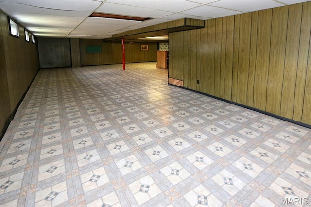 12713 Partridge Run Dr, Florissant, MO 63033 - finished basement with wood walls, a paneled ceiling, and light floors