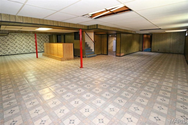 12713 Partridge Run Dr, Florissant, MO 63033 - finished below grade area featuring stairway, a drop ceiling, wallpapered walls, wood walls, and water heater