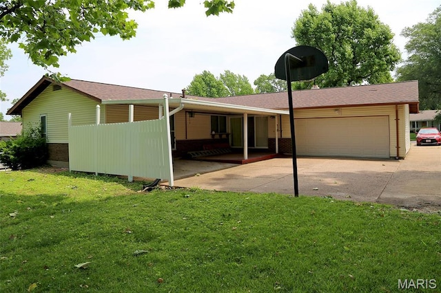 12713 Partridge Run Dr, Florissant, MO 63033 - view of front of home featuring an attached garage, concrete driveway, a front yard, and roof with shingles
