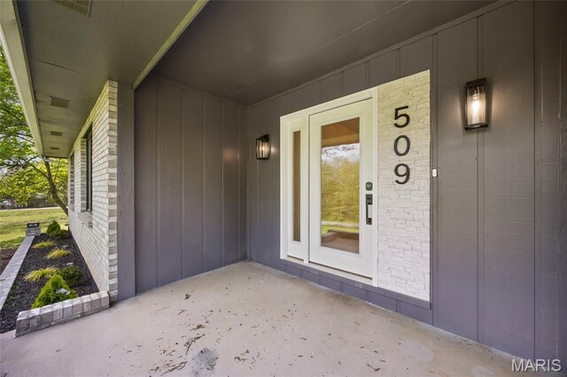 509 Saint Francois Rd, Bonne Terre, MO 63628 - doorway to property with brick siding and board and batten siding