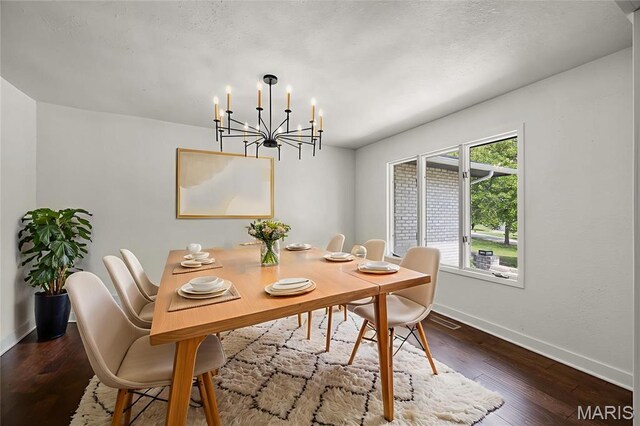 509 Saint Francois Rd, Bonne Terre, MO 63628 - dining room with baseboards, a chandelier, and dark wood-type flooring