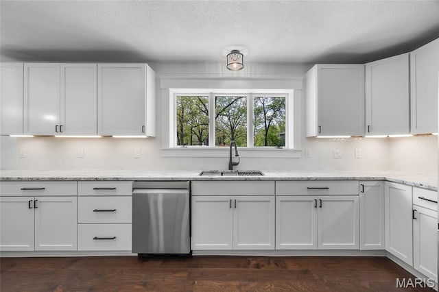 509 Saint Francois Rd, Bonne Terre, MO 63628 - kitchen with stainless steel dishwasher, a sink, white cabinetry, decorative backsplash, and a textured ceiling