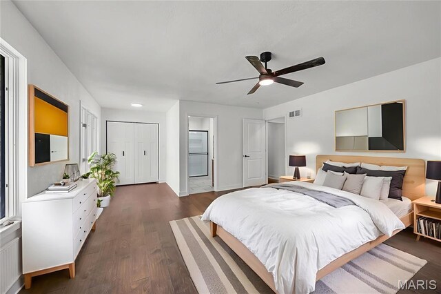509 Saint Francois Rd, Bonne Terre, MO 63628 - bedroom with dark wood-type flooring, baseboards, connected bathroom, and ceiling fan
