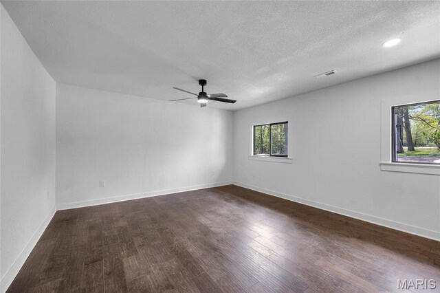 509 Saint Francois Rd, Bonne Terre, MO 63628 - unfurnished room with a textured ceiling, a ceiling fan, dark wood finished floors, baseboards, and recessed lighting