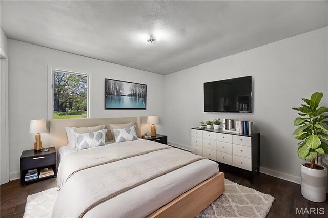 509 Saint Francois Rd, Bonne Terre, MO 63628 - bedroom with dark wood-type flooring and baseboards