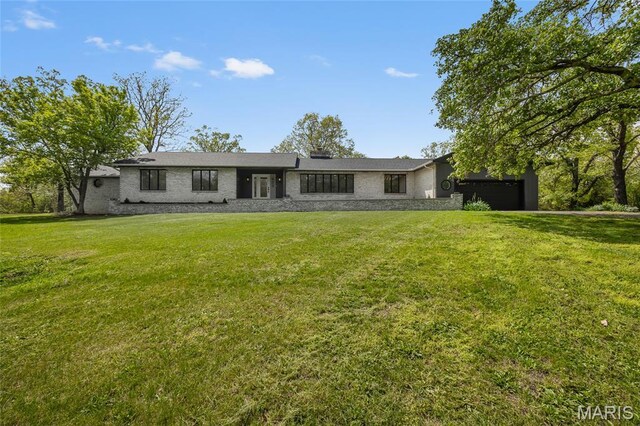 509 Saint Francois Rd, Bonne Terre, MO 63628 - view of front of house featuring a front lawn and a garage
