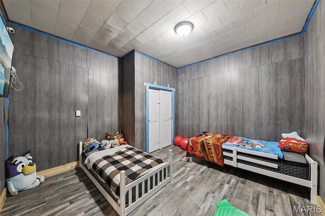 1618 N State St, Litchfield, IL 62056 - bedroom featuring wood finished floors and wood walls