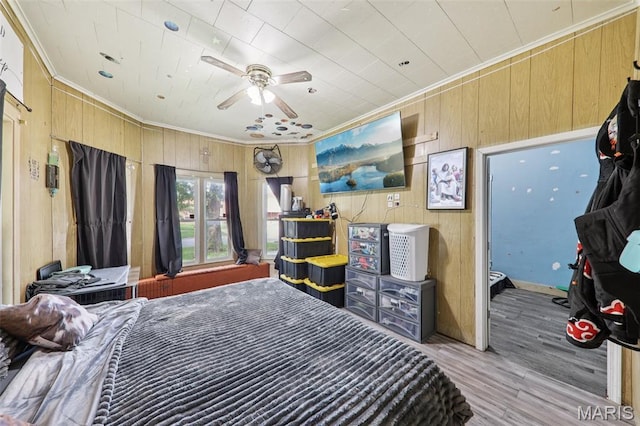 1618 N State St, Litchfield, IL 62056 - bedroom with ornamental molding, wooden walls, and wood finished floors