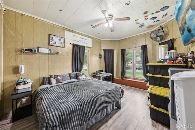 1618 N State St, Litchfield, IL 62056 - bedroom with ornamental molding, wood walls, and wood finished floors