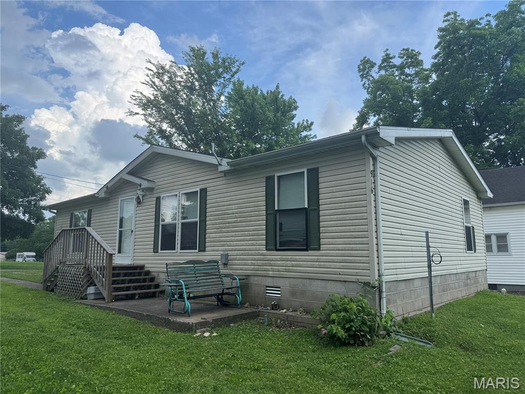 916 2nd St, Scott City, MO 63780 - view of property exterior with a yard and a patio