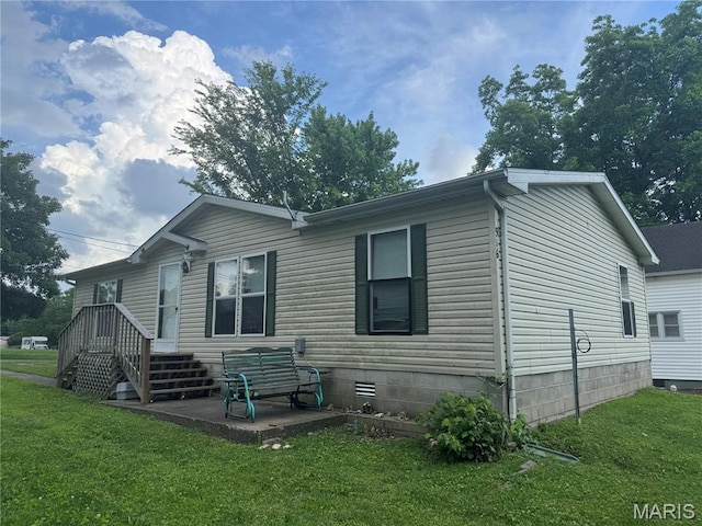 916 2nd St, Scott City, MO 63780 - view of property exterior with a yard and a patio