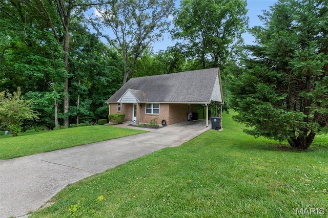 1407 Perry Ave, Cape Girardeau, MO 63701 - ranch-style house with concrete driveway, a front lawn, brick siding, and an attached carport