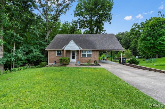 1407 Perry Ave, Cape Girardeau, MO 63701 - view of front of house with driveway, an attached carport, a front lawn, brick siding, and a shingled roof