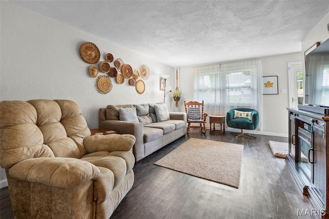 1407 Perry Ave, Cape Girardeau, MO 63701 - living area with a textured ceiling, dark wood-style floors, and baseboards