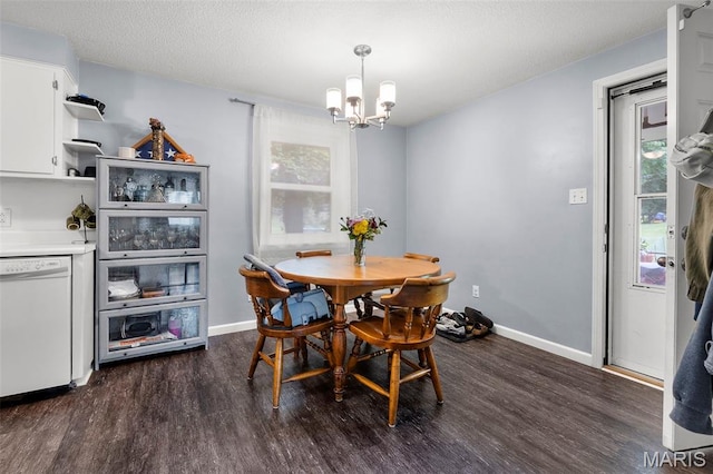 1407 Perry Ave, Cape Girardeau, MO 63701 - dining area with a chandelier, dark wood-style floors, and baseboards