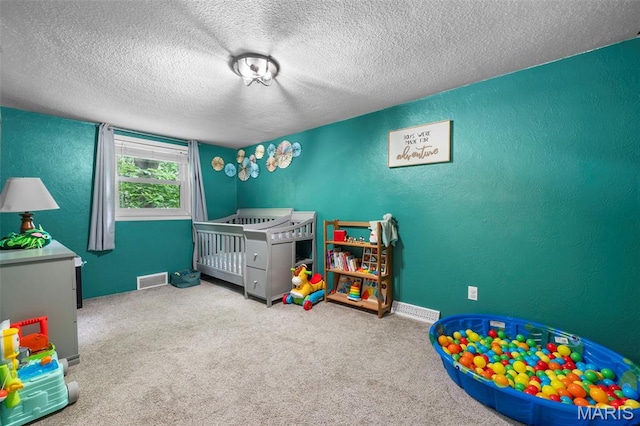 1407 Perry Ave, Cape Girardeau, MO 63701 - bedroom with a textured ceiling, carpet floors, and a textured wall