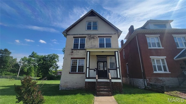 5714 Maple Ave, Saint Louis, MO 63112 - traditional-style house with brick siding and a front lawn