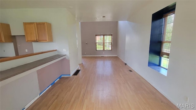 5714 Maple Ave, Saint Louis, MO 63112 - hall featuring light wood-type flooring and baseboards