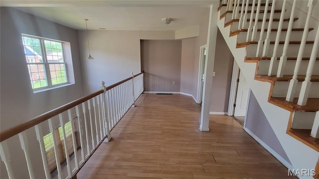 5714 Maple Ave, Saint Louis, MO 63112 - hallway featuring wood finished floors and baseboards