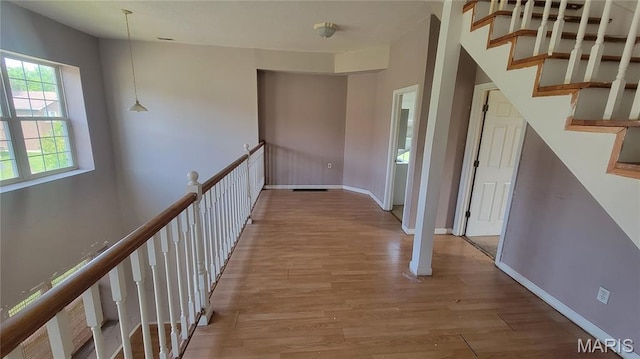 5714 Maple Ave, Saint Louis, MO 63112 - hall with wood finished floors and baseboards