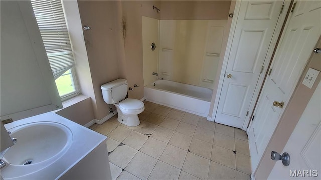 5714 Maple Ave, Saint Louis, MO 63112 - bathroom with tile patterned floors, bathing tub / shower combination, toilet, vanity, and baseboards