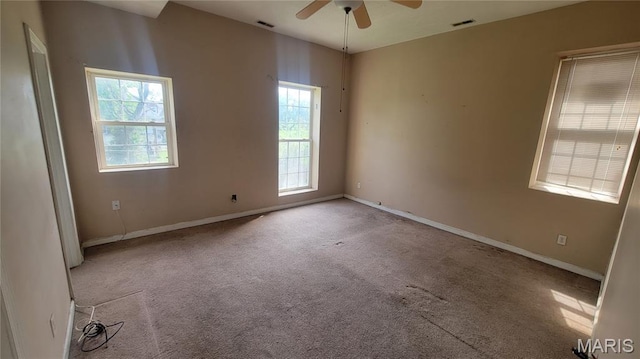 5714 Maple Ave, Saint Louis, MO 63112 - unfurnished room with plenty of natural light, a ceiling fan, carpet floors, and baseboards