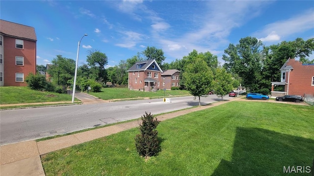 5714 Maple Ave, Saint Louis, MO 63112 - view of asphalt road with street lighting, sidewalks, and curbs