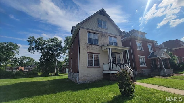 5714 Maple Ave, Saint Louis, MO 63112 - view of front facade featuring a front yard and brick siding